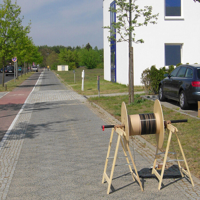 Fertigung eines 210 m langen Lichtwellenleiters